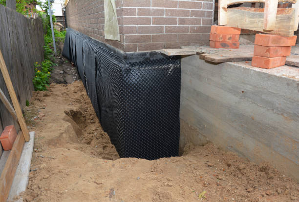 SJ Waterproofing Pros technician performing targeted Waterproofing assessment in Dayton, OH